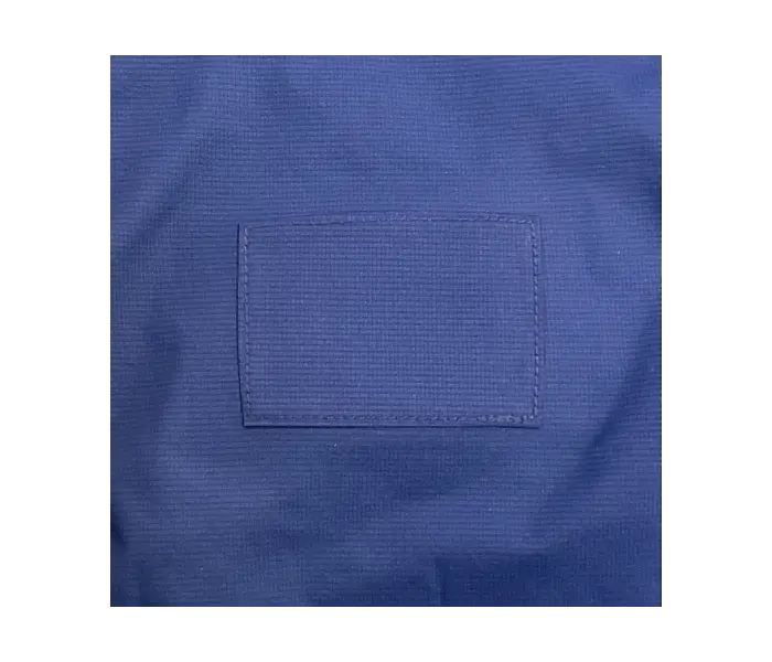 Rainwear after repair: A patch was applied over the tear.