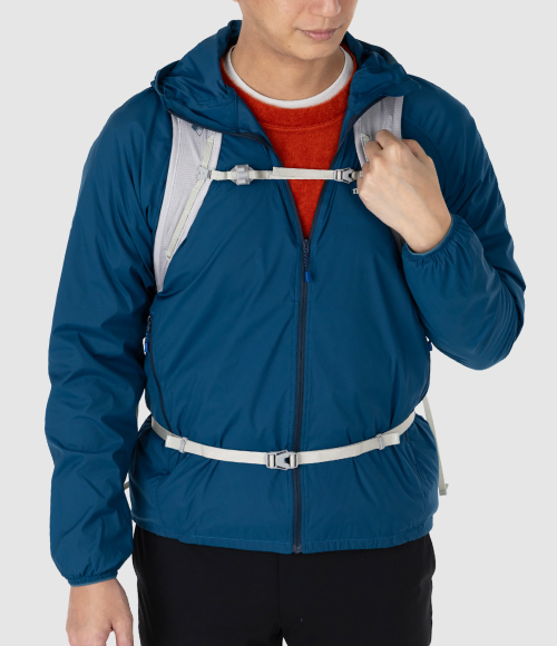 Shown here is an example of how the item is worn: layered under outerwear, with a backpack, and paired with the CLIMAAIR Light T-shirt.