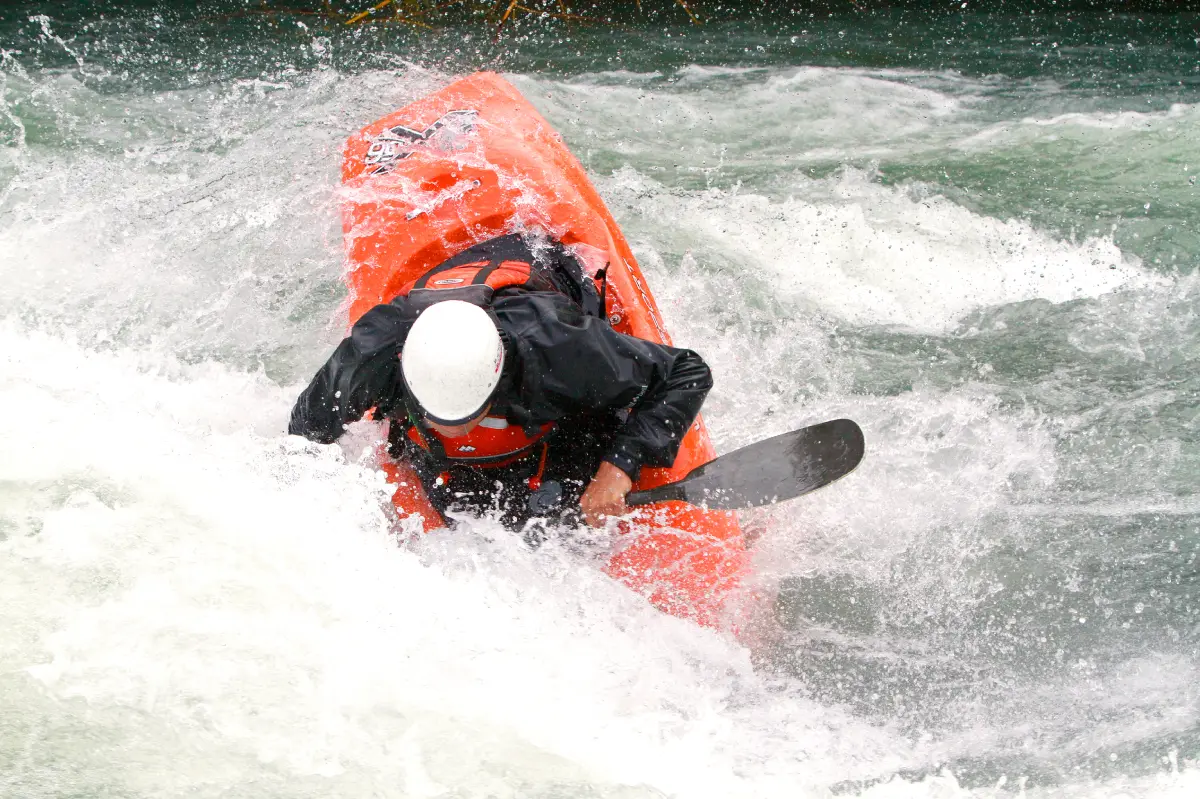 Paddling kayaks in rapids during the whitewater kayaking festival "CHECK IT OUT".