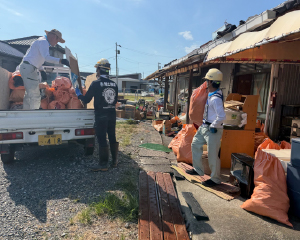 Transporting waste removed from a damaged home.