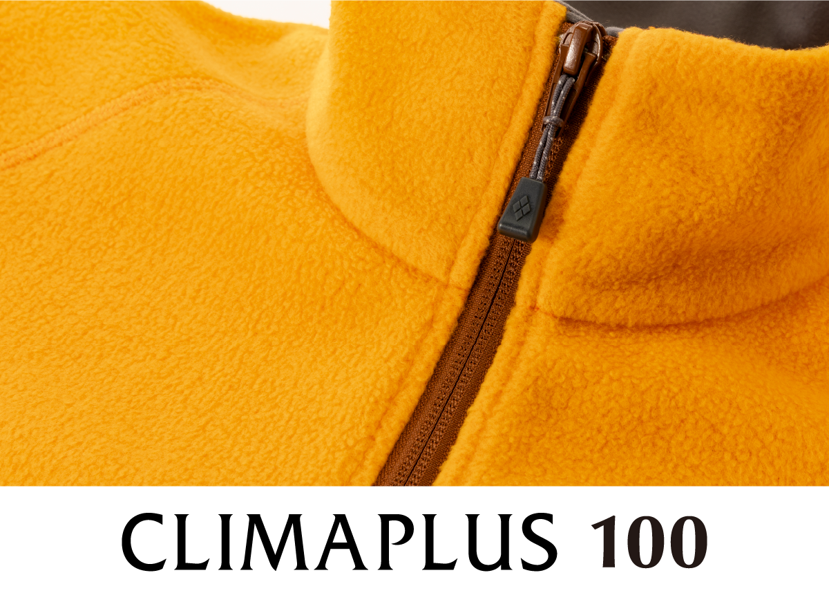 A photograph focusing on the fabric with the CLIMAPLUS 100 logo