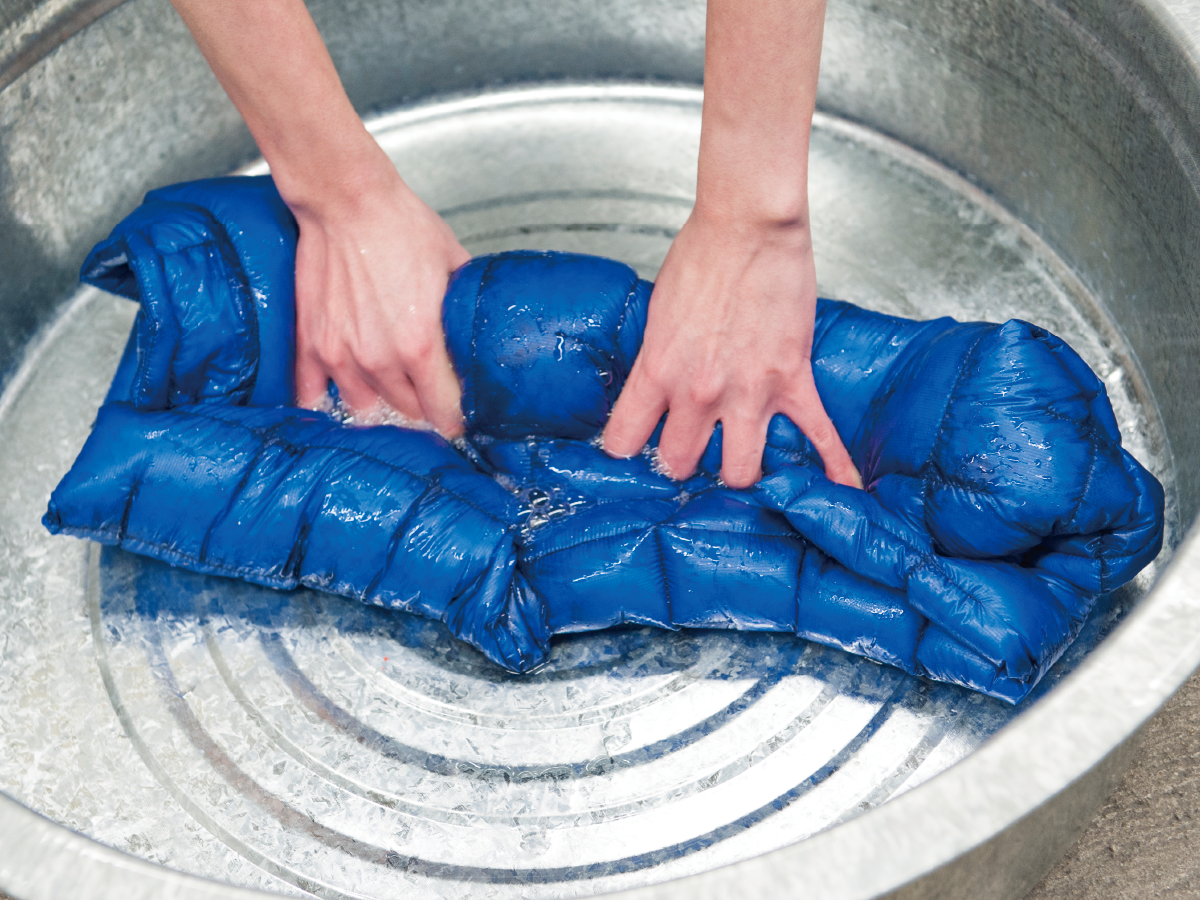 Rinsing down outerwear in a bucket