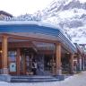 Winter exterior of the Grindelwald store with snow-covered mountains