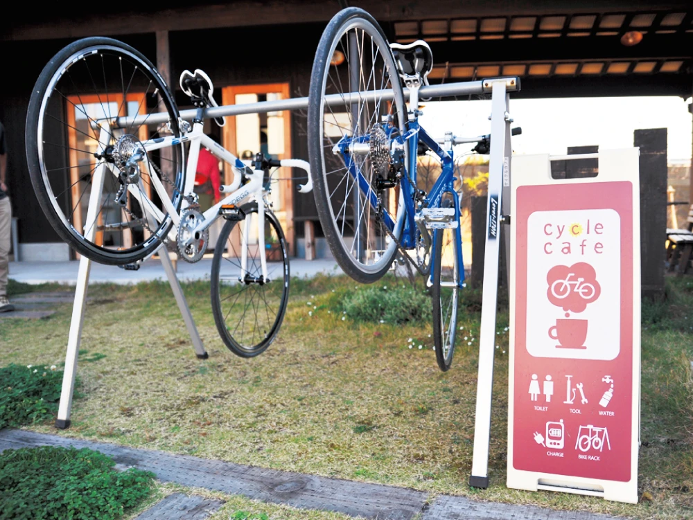 Two bicycles parked at a station of a Japan Eco Track partner shop