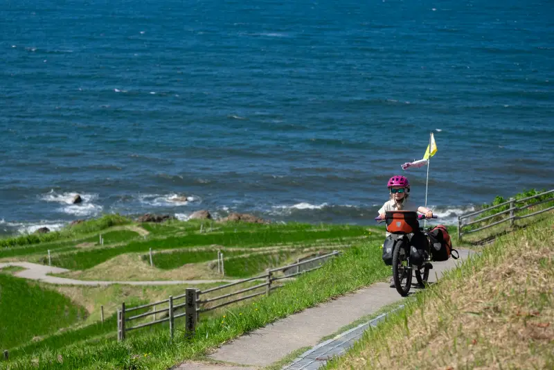 Fibie biking along the coast