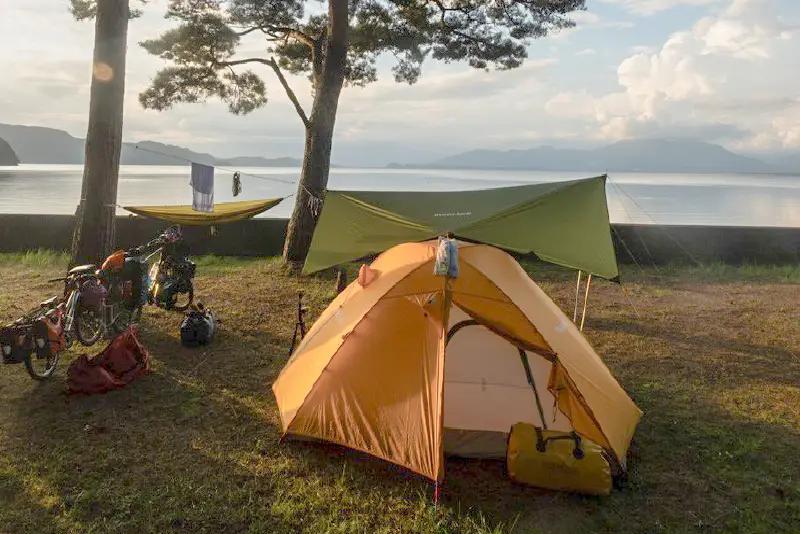 Tents and tarps set up along the seafront