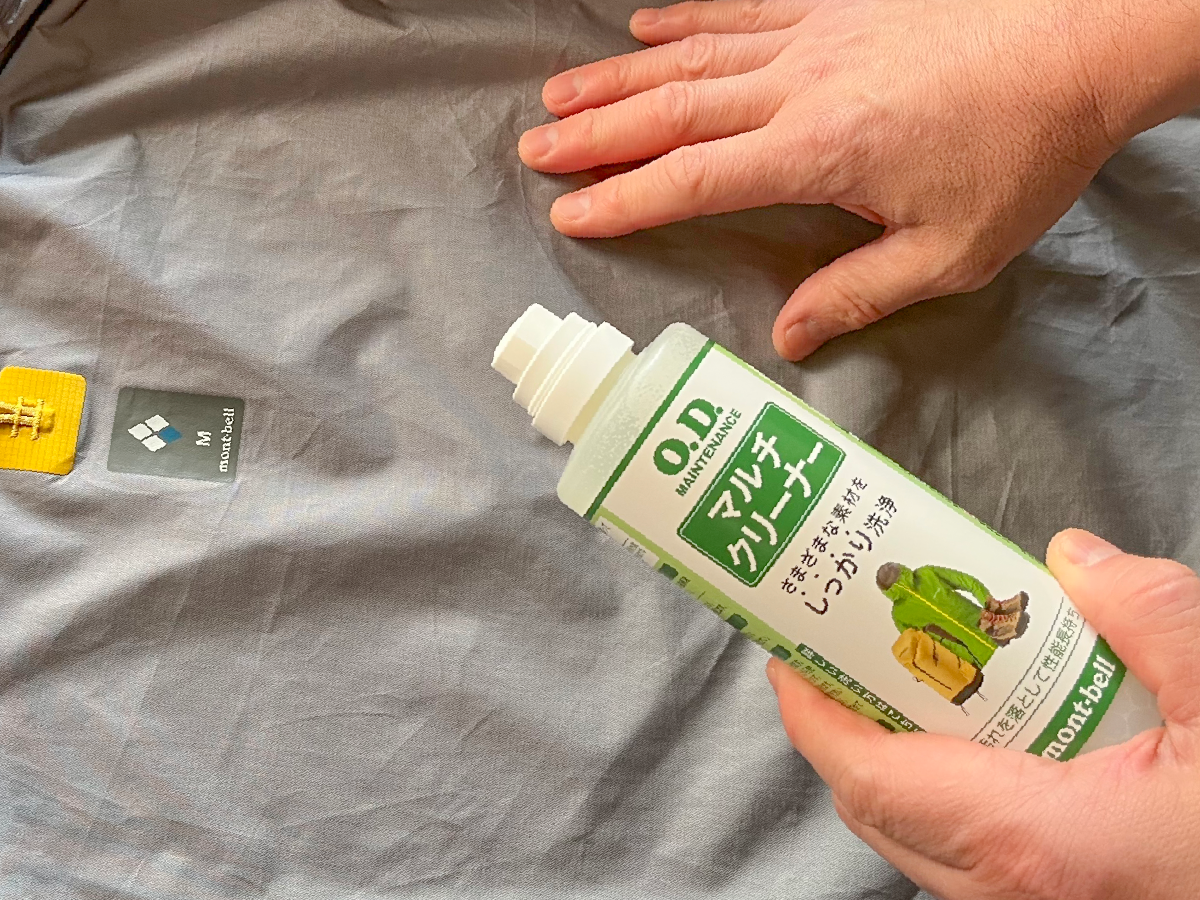 A photo of applying multi-cleaner to rainwear