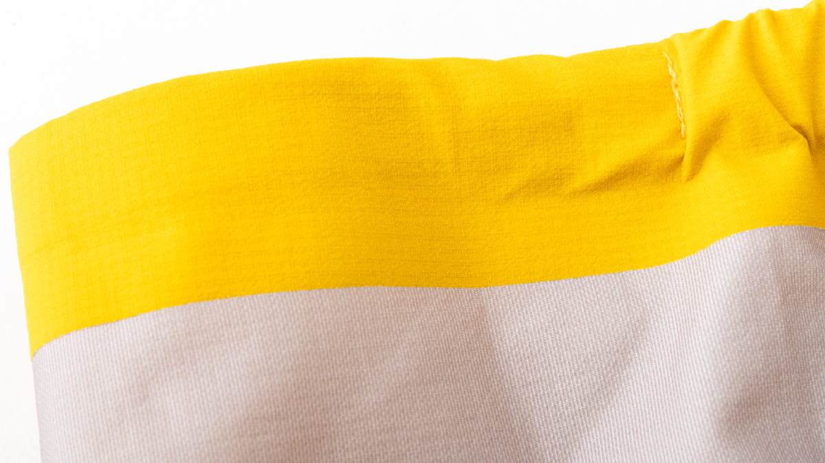 Sleeve cuffs finished with adhesive bonding