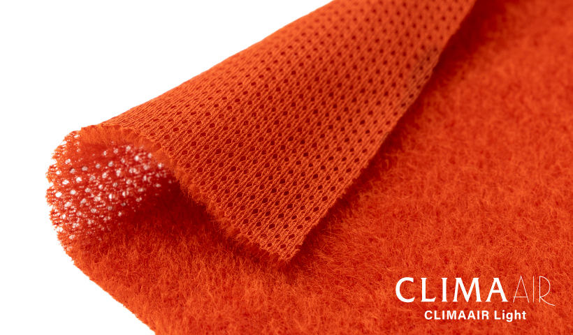 A close-up image of the CLIMAAIR Light fabric. The outer surface features a raised nap with longer fibers, while the inner surface is smoothly knitted.