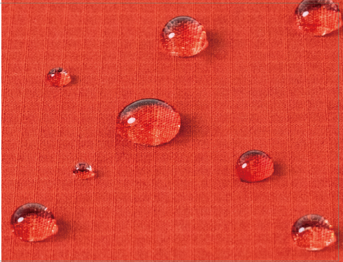 A depiction of the fabric surface repelling water