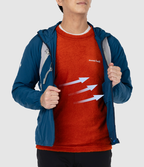 Shown here is an example of how it is worn: layered under an unzipped outer jacket, with a backpack and a CLIMAAIR Light T-shirt.