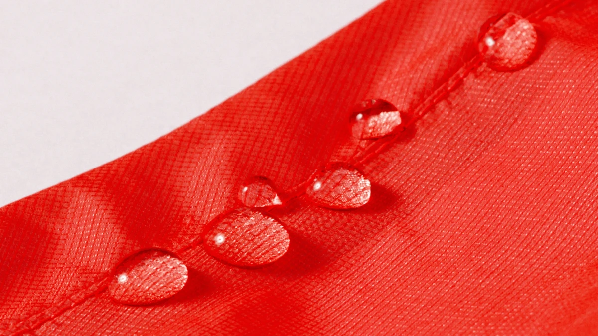 Image of water droplets rolling off the fabric surface