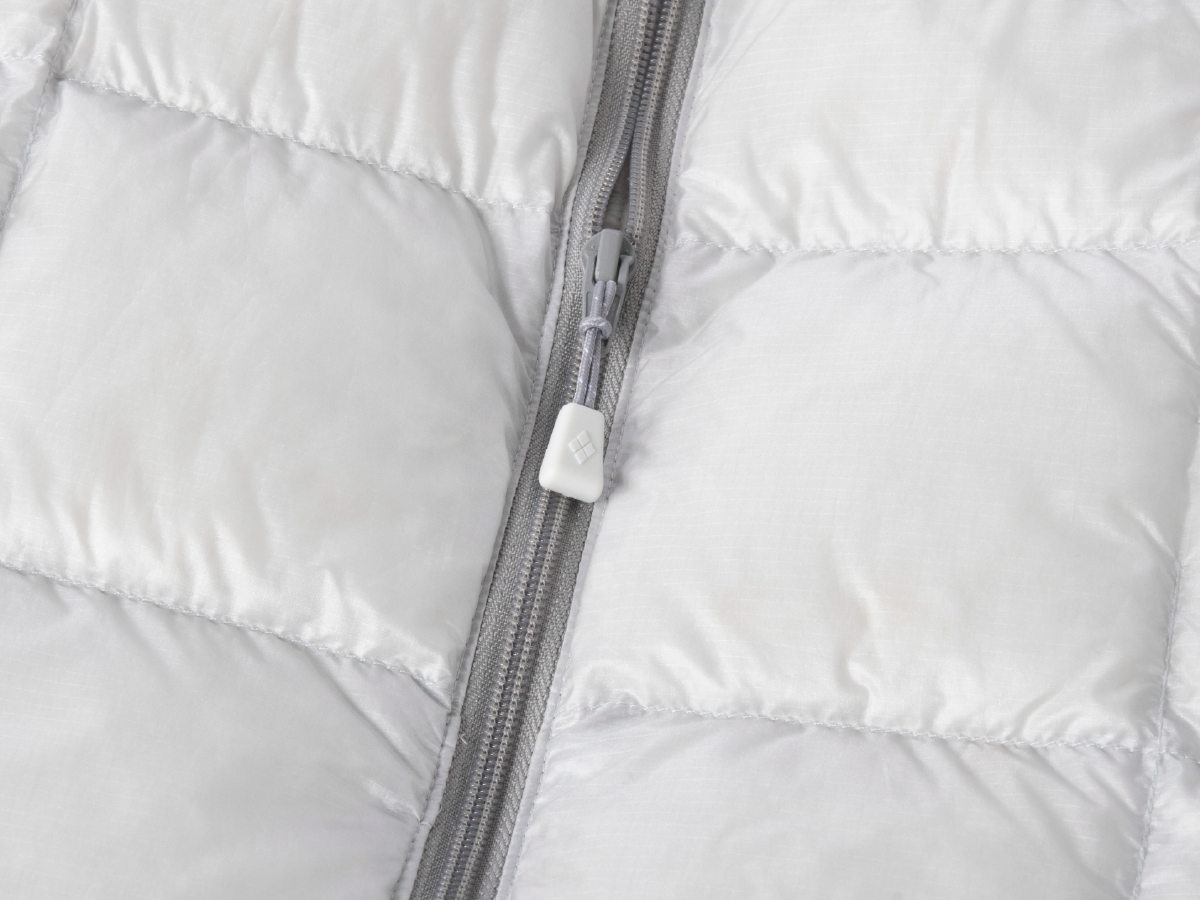 Close-up of the zipper area on down outerwear