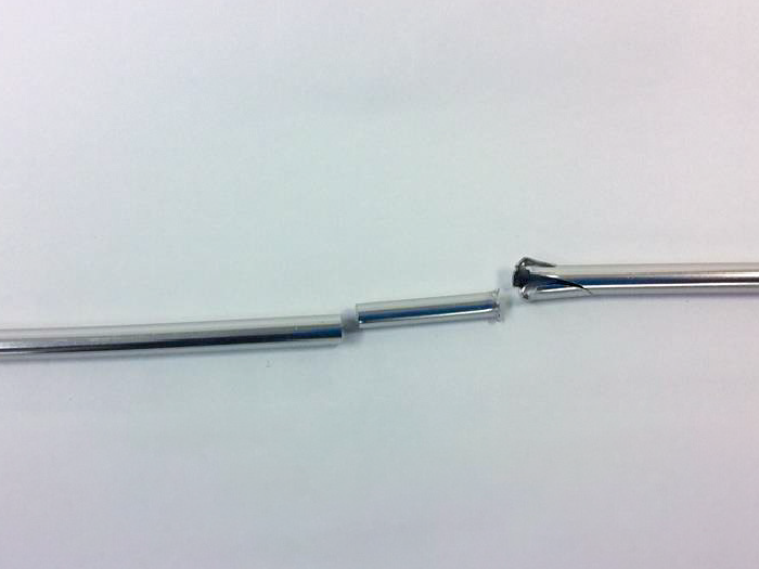 Tent pole before repair: Broken in two places.